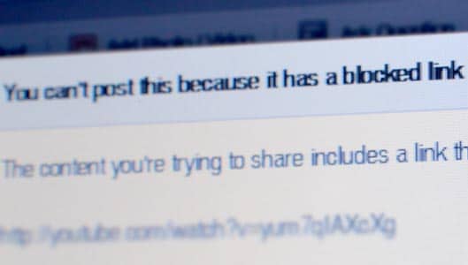 Why does Facebook block links to hoax-busting websites?