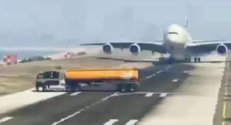 Does video show oil tanker drive in front of a landing aircraft? Fact Check