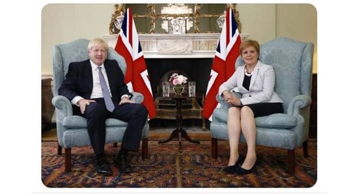 Does photo show Johnson and Sturgeon sitting in front of Union Jack flags? Fact Check